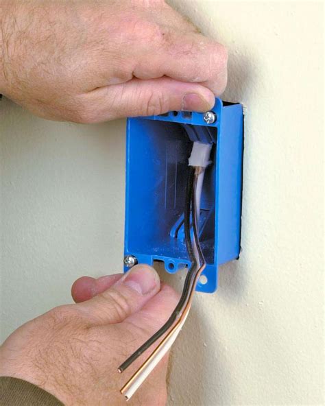 attach wire to electric box|installing wall mounted electrical boxes.